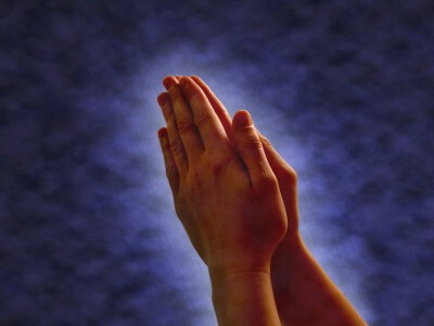 Praying Hands - hands clasped together in... Praying Hands - hands clasped together in...